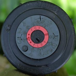 Closeup of a Toro sprinkler head replaced during a routine sprinkler repair in Burien